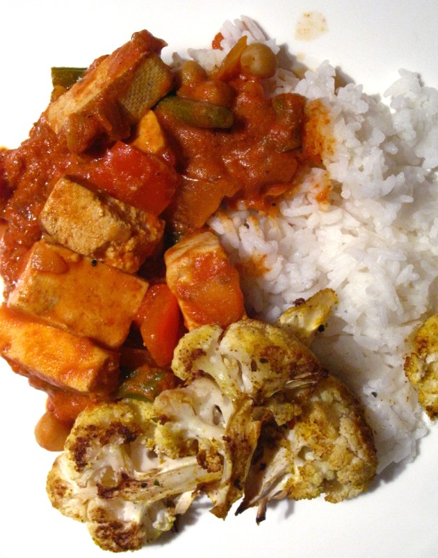Butter tofu served with rice and roasted cauliflower.